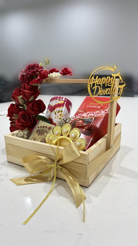 Wooden basket with red roses and Happy Diwali topper